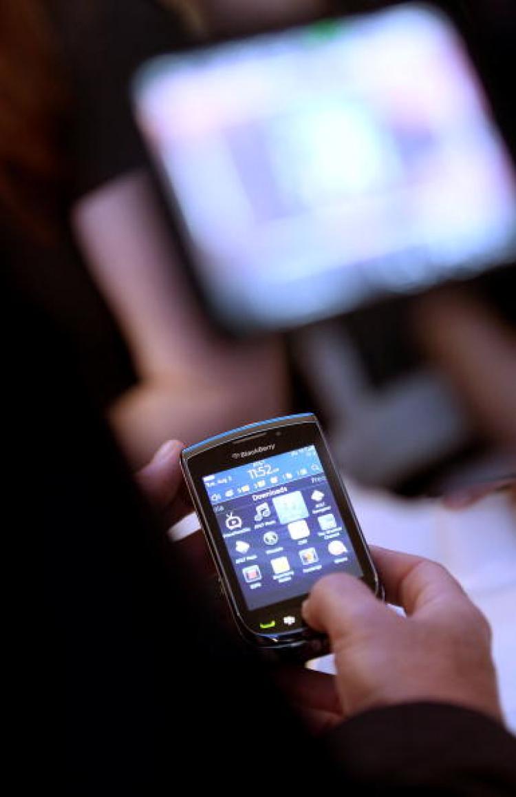 The new Blackberry Torch 9800 smartphone is seen after being unveiled at a news conference August 3, 2010, in New York City. Smartphones have helped Britons cram more media consumption into their day, according to Ofcom research. (Getty Images)