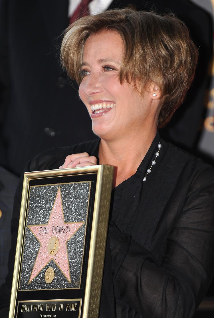 Actress Emma Thompson poses at her star on the Hollywood Walk of Fame during the star presentation ceremony in front of the historic Pig 'n Whistle British Pub on Aug. 6, 2010 in the Hollywood section of Los Angeles. (Robyn Beck/AFP/Getty Images)