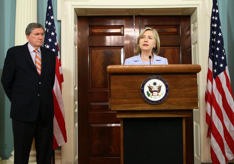 U.S. Secretary of State Hillary Clinton (R) makes a statement regarding the killing of ten medical relief workers, with six Americans among them, in Afghanistan as U.S. Special Envoy for Afghanistan and Pakistan Richard Holbrooke (L) listens on August 9,  (Alex Wong/Getty Images)