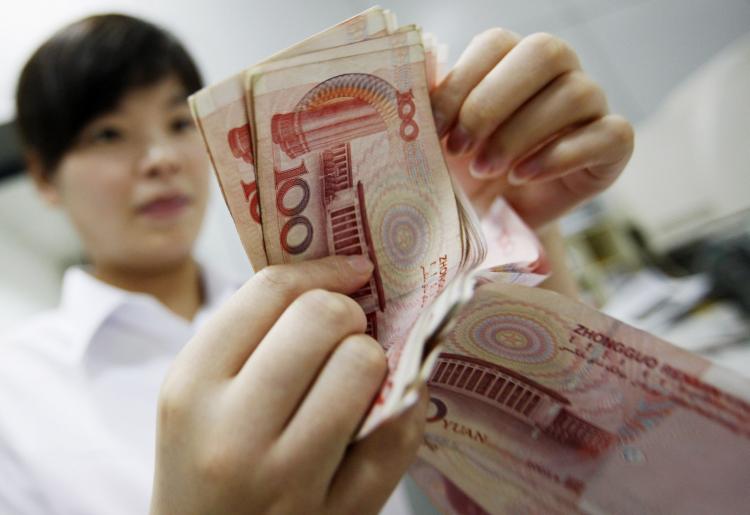 The Chinese regime continues to manipulate the yuan/dollar rate to China's advantage. (AFP/Getty Images)