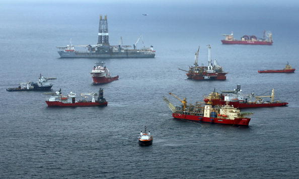 Vessels work at the site of the Deepwater Horizon accident off the shore of Louisiana in August 2010. (Photo by Win McNamee/Getty Images)
