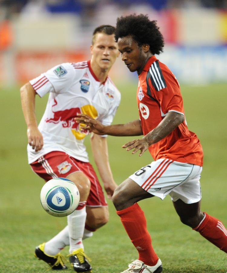 Julian de Guzman (R) of Toronto FC and Seth Stammler (L) of the New York Red Bulls battle at Red Bull Arena in Harrison, New Jersey. (Stan Honda/AFP/Getty Images)