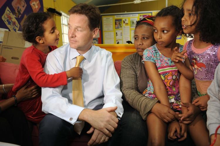 Britain's Deputy Prime Minister Nick Clegg helps children make pizzas during a visit to the Shepherd's Bush Families Project and Children's Centre August 18, in west London. (M Chris Harris - WPA Pool/Getty Images)