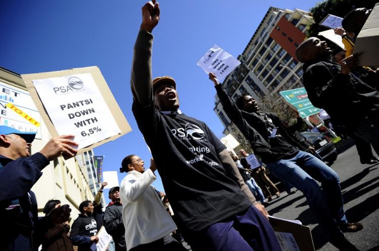 Dozens of public workers demonstrate on August 19, 2010 during their lunch break in support of the ongoing general strike in the Cape Town CBD in Cape Town, South Africa. (Gianluigi Guercia/AFP/Getty Images)