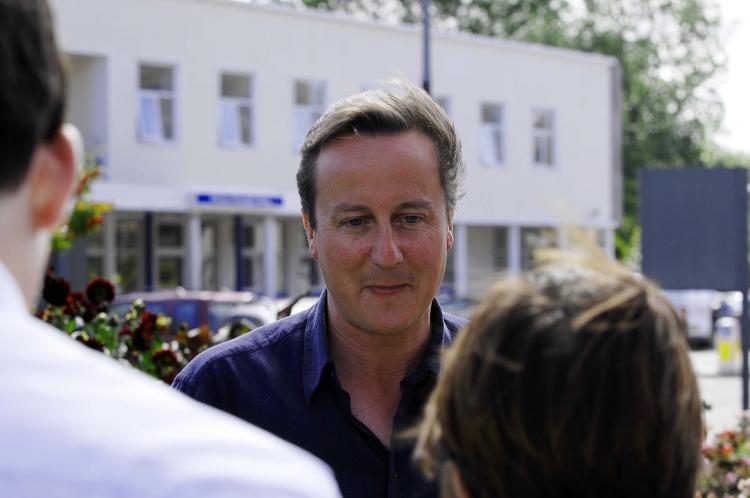 Prime Minister David Cameron speaks to the media after the birth of his daughter at the Royal Cornwall Hospital on Aug. 24. The couple was on their summer holiday at Daymer Bay beach when the Prime Minister's wife went into labour earlier than expected. (Mike Thomas/Western Morning News - Pool/Getty Images)