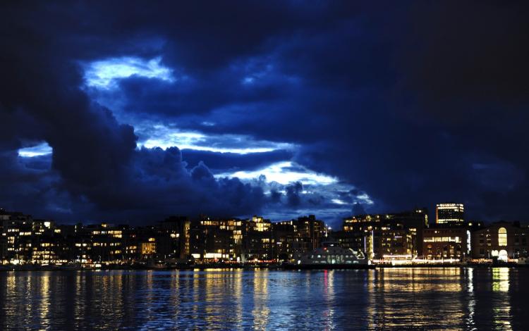 Skyline in Oslo, rated the most expensive city, at the Norwegian capital's waterfront and entertainment area, as a break in the cloud cover lets light in, at dusk.  (Odd Andersen/Getty Images )