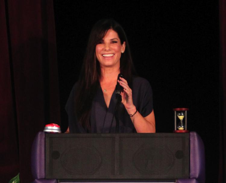 Sandra Bullock addresses attendees at the Warren Easton Charter High School Health Clinic ribbon cutting ceremony Aug. 29 in New Orleans City. (James Crump/Getty Images)