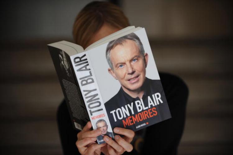A person reading former British Prime Minister Tony Blair's book, 'Memoires,' published on September 1, by Albin Michel, in Paris. 'Memoirs' features Blair's thoughts about the invasion of Iraq, Lady Diana, Iran, Clinton, Bush, Brown, and some personal issues. (Lionel Bonventure/Getty Images )