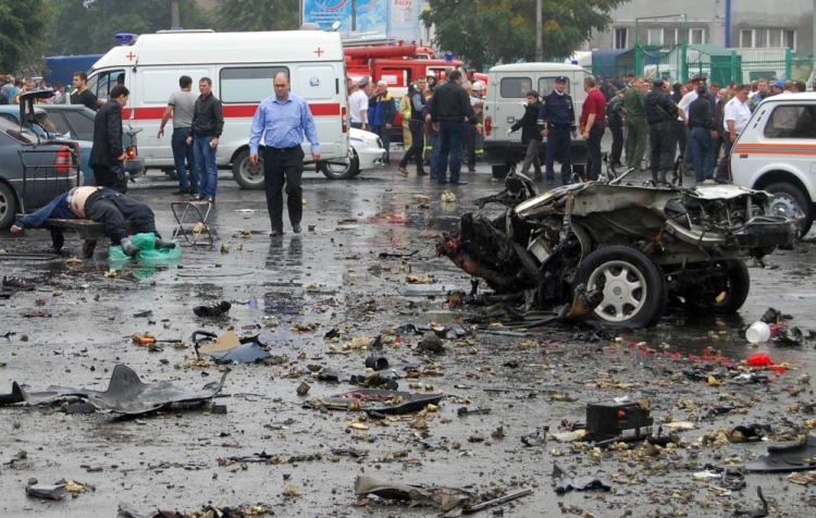 Russian investigators examine the site of a blast near a market in Vladikavkaz on September 9, 2010. (STR/AFP/Getty Images)
