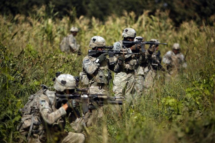 US soldiers with the 101st Airborne Division Alpha Battery 1-320th during a patrol on the outskirts of the town of Jellawar in The Arghandab Valley on September 10, 2010. (Patrick Baz/AFP/Getty Images)