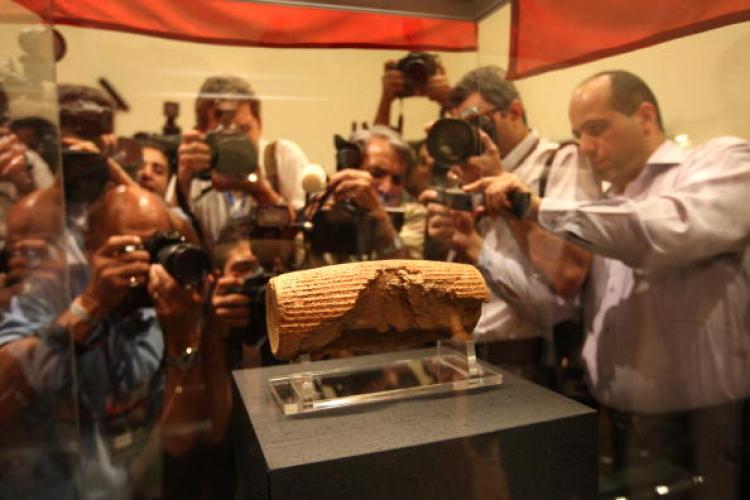 Photographers at the unveiling of the Cyrus Cylinder at the National Museum of Iran in Tehran last year. The artefact dating from the 6th century BC has been returned on loan to Iran by the British Museum in London. (Atta Kenare/AFP/Getty Images)