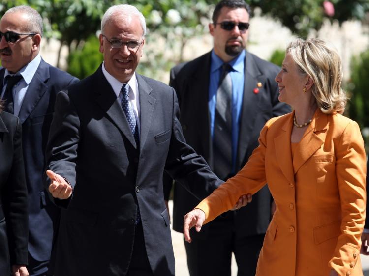 Palestinian peace negotiator Saeb Erakat welcomes US Secretary of State Hillary Clinton at the Palestinian Authority headquarter in the West Bank city of Ramallah on September 16, 2010. (Abbas Momani/AFP/Getty Images)