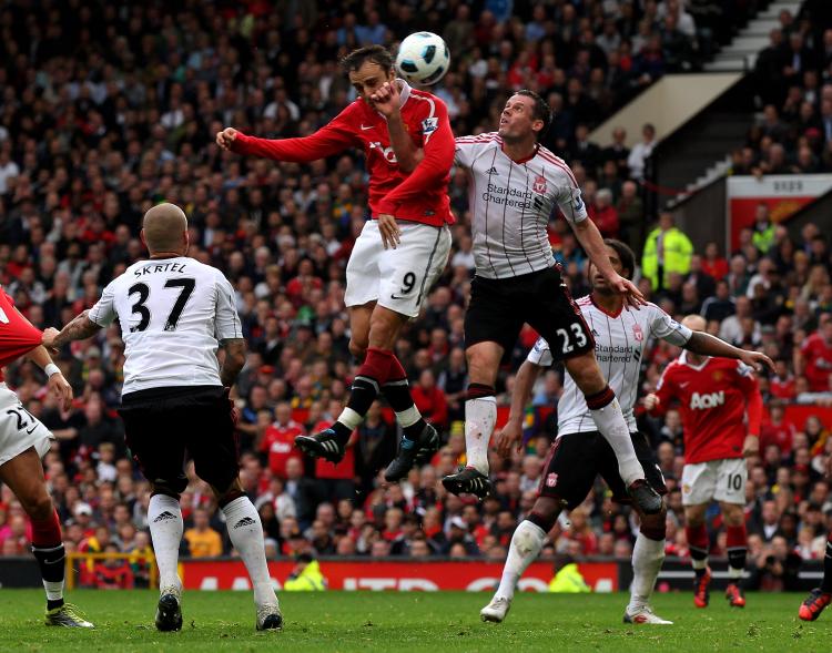 Dimitar Berbatov of Manchester United scores his team's third goal to complete his hat-trick during the Barclays Premier League match between Manchester United and Liverpool at Old Trafford on Sept. 19. (Alex Livesey/Getty Images)