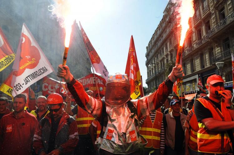 French unions staged mass protests and strikes on Sept. 23, in Marseille, hoping to bring more than two million onto the streets to defy President Nicolas Sarkozy's retirement reform plan to hike the retirement age to 62.  (Anne-Christine Poujoulat/Getty Images)