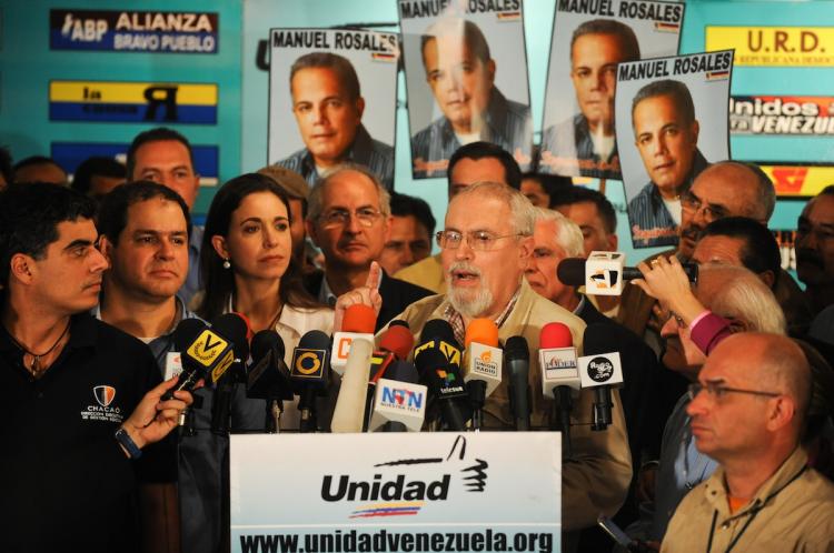 Members of the opposition bloc to the government of President Hugo Chavez called 'Board of Unity' (MUD) offer a press conference after the results of the election early on September 27, in Caracas. (Miguel Gutierrez/Getty Images )