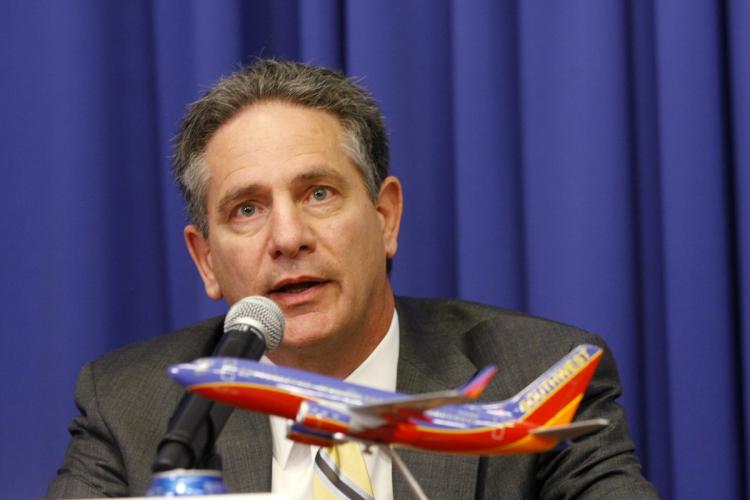 AirTran Chairman, President & CEO Robert L. Fornaro gives a press conference about Southwest Airlines' plan to merger with AirTran Airways at Southwest Airlines Corporate Headquarters September 27, in Dallas, Texas.   (Lawrence Jenkins/Getty Images )