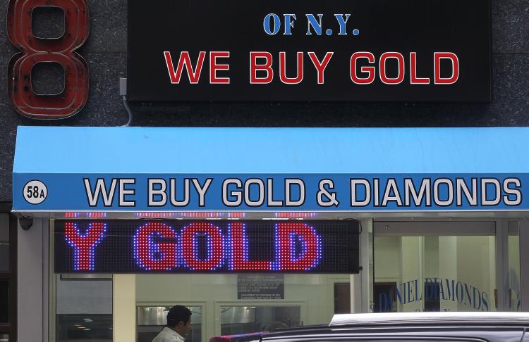 A sign reading 'We Buy Gold & Diamonds' is displayed in the Diamond District September 29, 2010 in New York City. (Mario Tama/Getty Images)