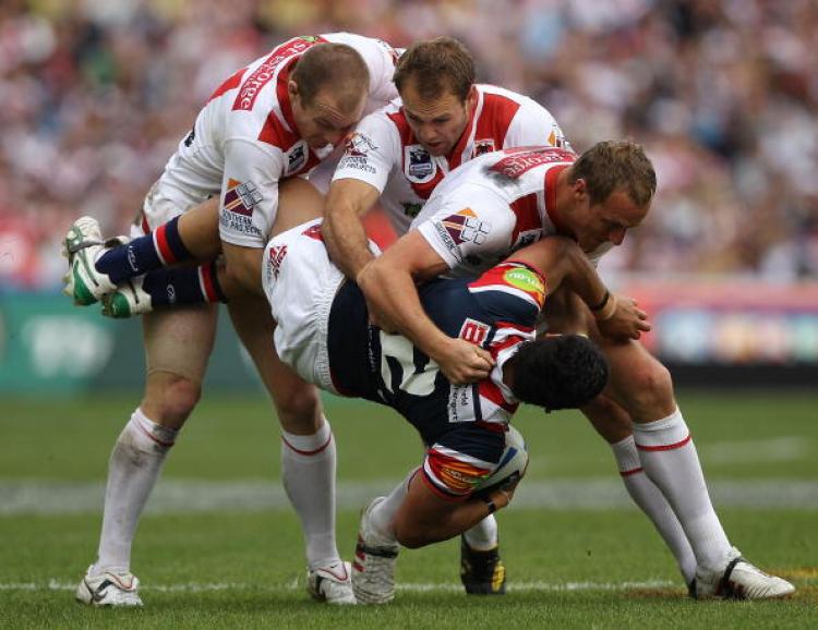 Joseph Leilua of the Roosters is tackled during the NRL Grand Final match between the St George Illawarra Dragons and the Sydney Roosters at ANZ Stadium on Oct. 3. (Robert Gray/Getty Images) Joseph Leilua of the Roosters is tackled during the NRL Grand Final match between the St George Illawarra Dragons and the Sydney Roosters at ANZ Stadium on Oct. 3. (Robert Gray/Getty Images)