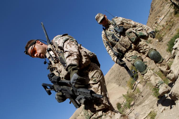 German Bundeswehr soldiers patrol high ground during a regular patrol on October 11, 2010 in Narwan, Afghanistan.  (Miguel Villagran/Getty Images)