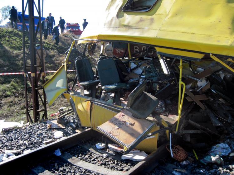 The wreckage of a bus which crashed into a train at a level crossing in Marganest, Ukraine. The bus packed with rush-hour commuters crashed into a train after jumping a red traffic light, killing 40 people and leaving another 10 wounded, officials said.   (STR/Getty Images)