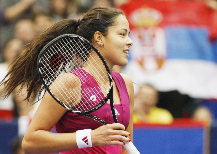 Ana Ivanovic celebrates after beating her opponent Patty Schnyder of Switzerland 6-1, 6-2 in the final of the WTA Open tournament on Oct. 17 in Austria. (Dieter NAGL/AFP/Getty Images)
