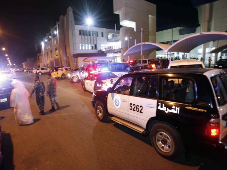 Kuwaiti police guard the entrance of the SCOPE television station in Kuwait City after a mob attack on its studios late October 17, 2010. (Yasser Al-Zayyat/AFP/Getty Images)