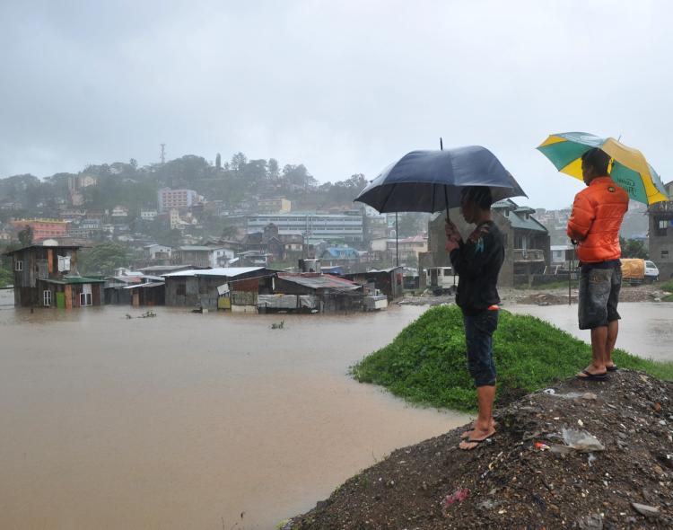 Residents looking over their homes submerged by flooding due to Typhoon Megi north of Manila on October 19. Heavy rains once again continue to cause major flooding and landslides in the Philippines.  (Ted Aljibe/Getty Images)