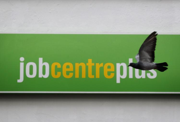 Public sector job cuts will be less than the 490,000 forecasted. A pigeon flew passed a Job Centre sign in Westminster on October 21, 2010, the day the OBC made its initial prediction on the spending review.  (Dan Kitwood/Getty Images)