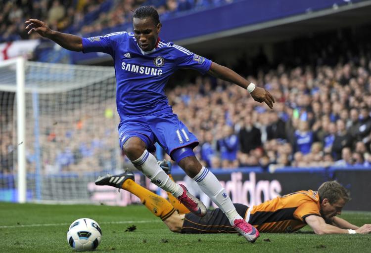 Chelsea's Ivorian striker Didier Drogba (L) vies with Wolverhampton Wanderers Scottish defender Christophe Berra (R) at Stamford Bridge in London on Saturday. (Glyn Kirk/AFP/Getty Images)