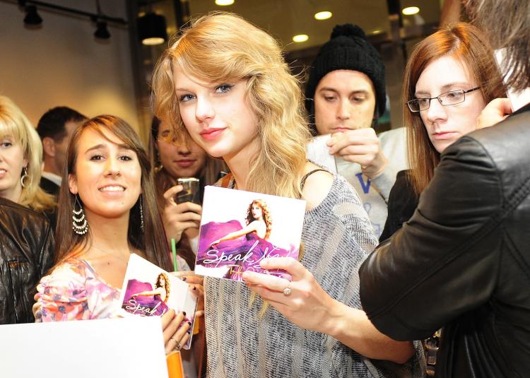 Singer Taylor Swift purchases her new album 'Speak Now' at the Times Square Starbucks on October 25 in New York City. The album is on sale at Starbucks nationwide. (Keith Bedford/Starbucks via Getty Images)