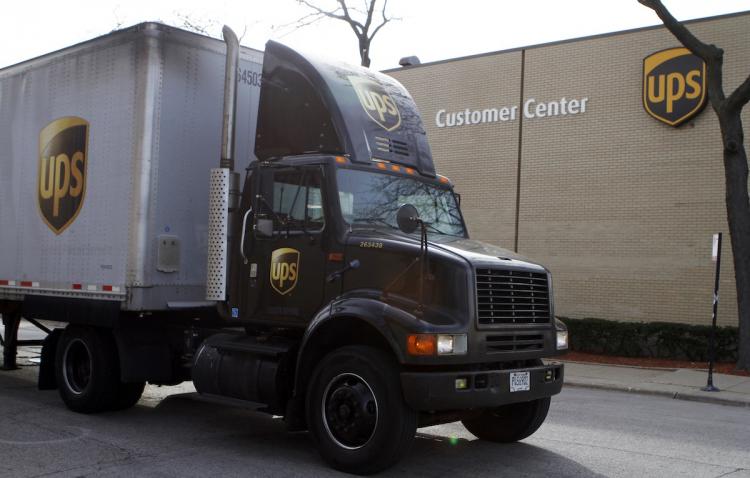 A United Parcel Service (UPS) truck leaves the yard October 29, in Chicago, Illinois.  (Frank Polich/Getty Images )