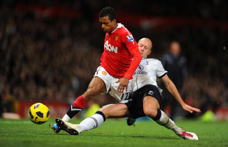 MANCHESTER UTD V TOTTENHAM HOTSPUR: Nani of Man United in action with Spurs Alan Hutton during the Barclays Premier League match at Old Trafford on Saturday. (Michael Regan/Getty Images)