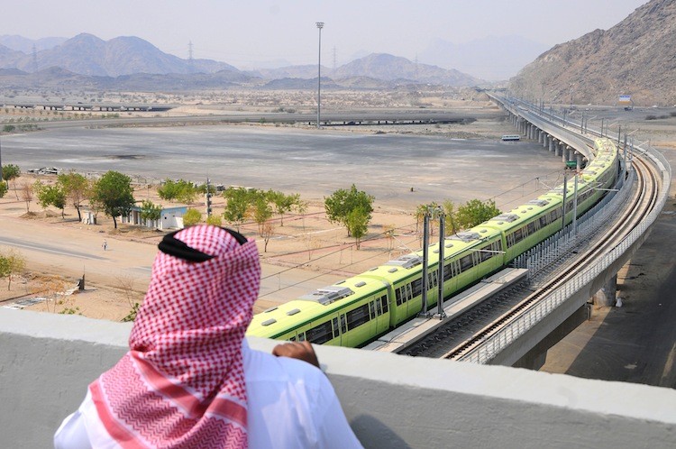 A man watches the Saudi Arabian Mecca Light Rail (MLR), a China Railway Construction Corporation (CRCC) project, in Saudi Arabia on November 2, 2010. To date the light rail has incurred losses amounting to 4.13 billion yuan (US$641.28 million) for the Chinese Government. (Amer Hilabi/AFP/Getty Images)