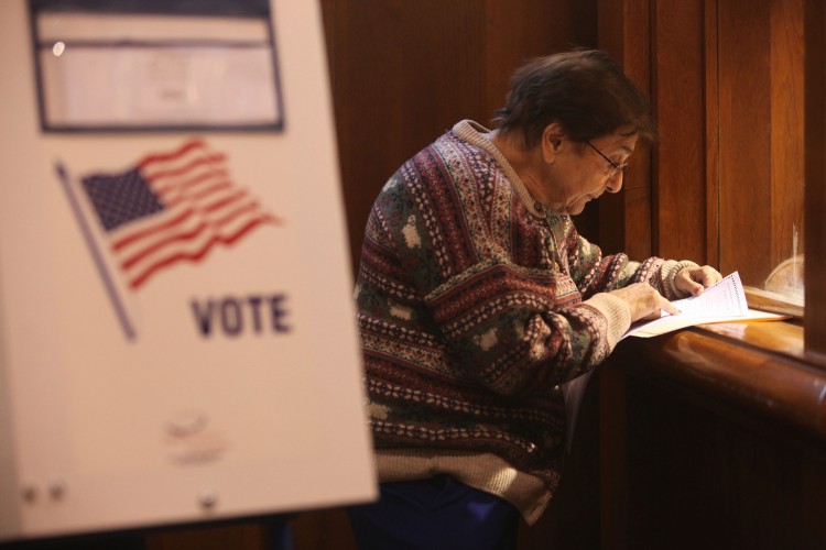 Santina Spadaro checks her ballot before casting her vote at a Manhattan polling place