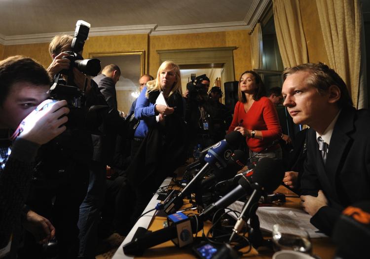 Wikileaks founder Julian Assange (R) faces photographers during a press conference at the Geneva Press Club on November 4, in Geneva. (Fabrice Coffrini/AFP/Getty Images)
