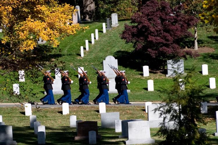 Members of the US Marine Corps Honor Guard march through Arlington National Cemetery