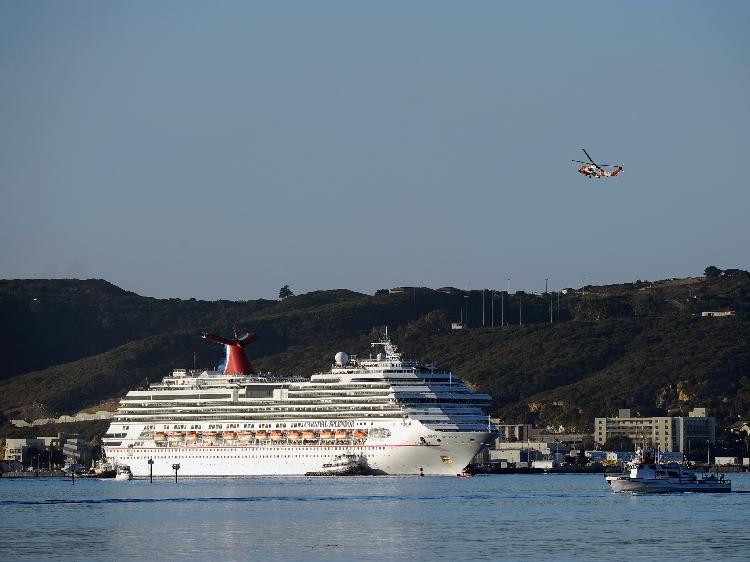 The stranded Carnival Splendor cruise ship is towed to San Diego Harbor by tug boats on November 11, 2010 in San Diego, California. The cruise ship lost power and became stranded off of California's coast after an engine room fire. (Kevork Djansezian/Getty Images)
