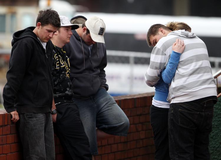 Worried friends and family stand outside the Red Cross Welfare Centre on Nov. 20 in Greymouth. (Hagen Hopkins/Getty Images)