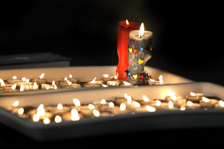 Burning candles at Holy Trinity Anglican Church in Greymouth during a candlelight vigil for the 29 miners presumed dead following the Pike River Mine explosion. (Martin Hunter Getty Images)