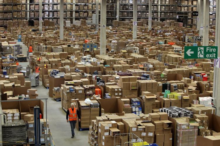TIS' THE ONLINE SEASON: Staff at the 800,000 sq ft Amazon Swansea fulfillment center process orders prior to 'Cyber Monday' as they prepare for their busiest holiday season on record on Nov. 26 in Swansea, Wales. (Matt Cardy/Getty Images)