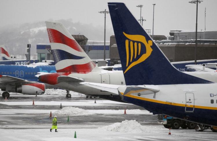 Planes are seen at a standstill in Edinburgh, Scotland.  (Jeff J Mitchell/ Getty Images)