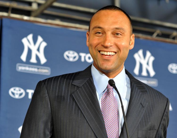 Derek Jeter, shortstop for the New York Yankees, said that he has a favorable opinion about all-star forward Carmelo Anthony coming to New York and playing for the Knicks.   (Tim Boyles/Getty Images)