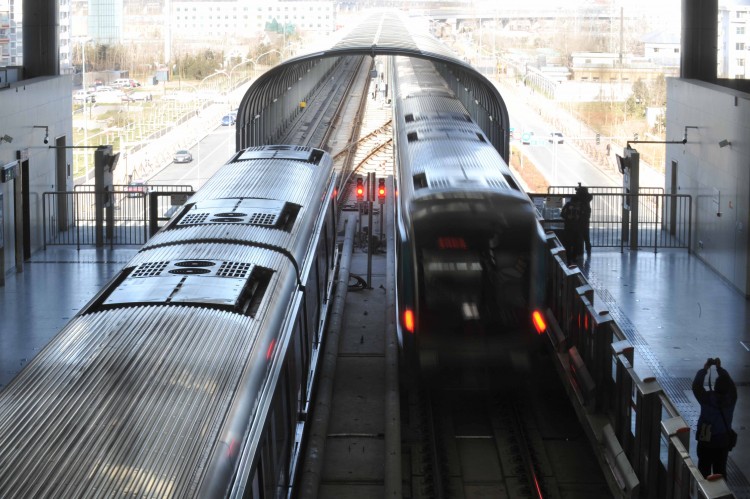 A subway train arrives at the newly completed Daxing subway station in Beijing last December 2010. China is now having a boom in subway construction; small or large, every other city is aspiring to build a rapid transit railway network. (STR/AFP/Getty)