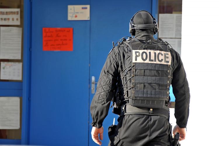 A member of French National Police Intervention Group forces (GIPN) walks in the nursery school, where a sword-wielding teenager was holding five children and a teacher on Dec. 13 in Besancon, France. (Harold Cunningham/Getty Images)