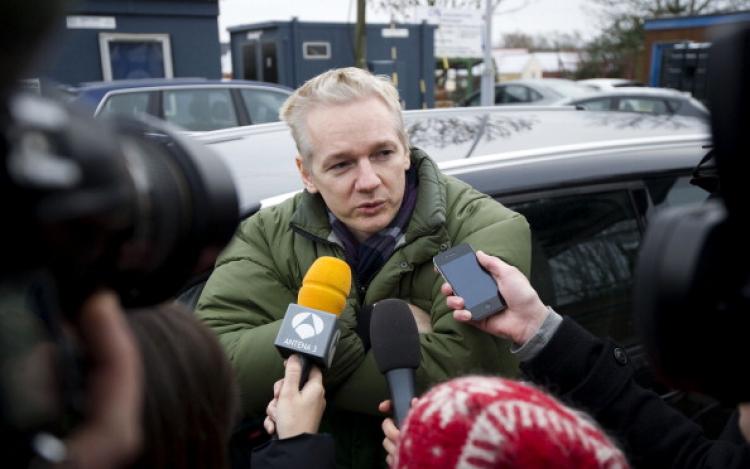 WikiLeaks founder Julian Assange speaks to journalists outside Diss train station in Norfolk on Dec. 18, 2010.  (Carl Court/AFP/Getty Images)