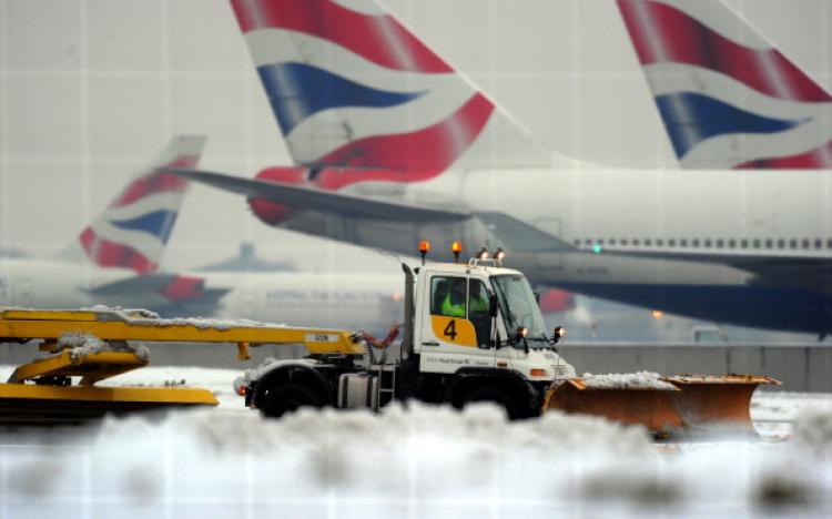 A worker operates a snow plough on Dec. 21 at London's Heathrow Airport, where passengers were forced to sleep on terminal floors during four days of chaos. (Adrian Dennis/AFP/Getty Images) A worker operates a snow plough on Dec. 21 at London's Heathrow Airport, where passengers were forced to sleep on terminal floors during four days of chaos. (Adrian Dennis/AFP/Getty Images)