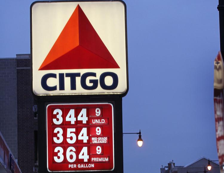 PAY AT THE PUMP: A gas station advertises gas in excess of $3 per gallon on Dec. 23 in Chicago, Ill. According to AAA, the national average price for a gallon of gas is above $3 for the first time since October 2008. (Scott Olson/Getty Images)