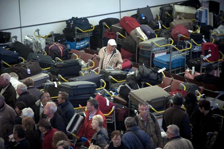 A man looks for his luggage at the Charles de Gaulle-Roissy airport, in Roissy-en-France, outside Paris. (Bertrand Langlois/AFP/Getty Images)