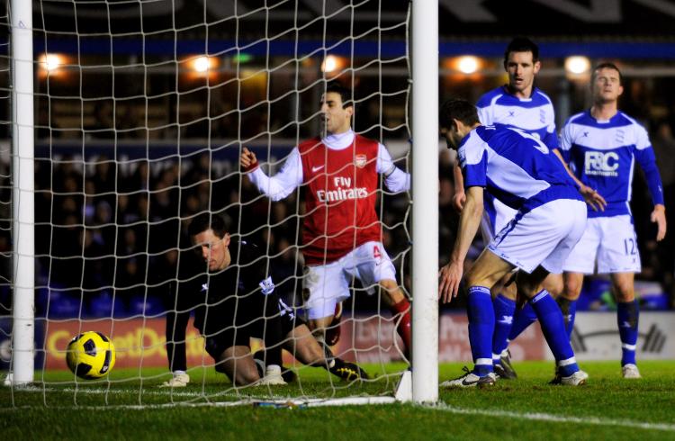 Birmingham concede a third goal to Arsenal as Roger Johnson scores an own goal past his goalkeeper Maik Taylor (L) at St. Andrews on Jan. 1 in Birmingham. (Michael Regan/Getty Images)