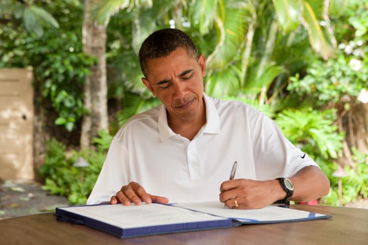 President Obama signs H.R. 847, the 'James Zadroga 9/11 Health and Compensation Act' on January 2, 2011in Kailua, Hawaii. The bill provides health coverage to the workers that were affected at ground zero after helping others and clearing the rubble during 9/11. (Pete Souza/White House via Getty Images)